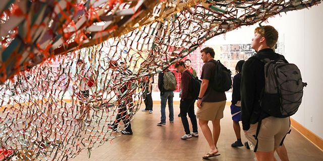 Students from Professor Anne Bost's Enduring Questions class visited the gallery of Artist in Residence Akindiya Akirash and had a chance to interact